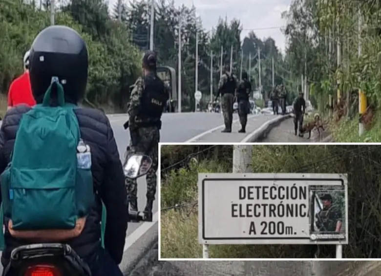 Adelante, el afiche dejado por las Disidencias. Atrás, las autoridades hacen el cierre preventivo de la vía. FOTO: Cortesía Denuncias Antioquia