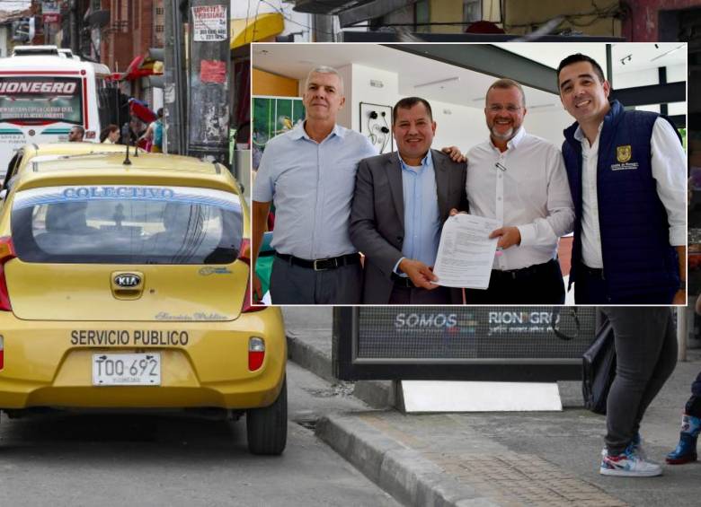 Adelante, firma del acuerdo entre municipios. Atrás, un taxi del municipio de Rionegro. Foto: Manuel Saldarriaga Quintero