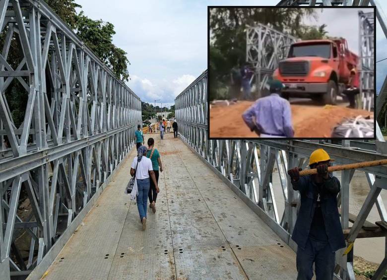 Adelante, un vehículo pesado pasando sobre el puente militar. Atrás, la estructura instalada sobre el río. FOTO: imágenes tomada de redes.