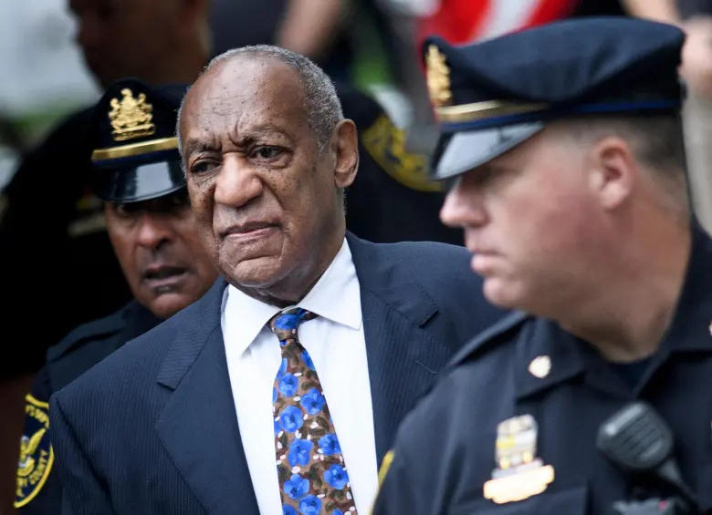 (FILES) US actor Bill Cosby arrives at court on September 24, 2018 in Norristown, Pennsylvania to face sentencing for sexual assault. A woman who said she was drugged and sexually assaulted by veteran US entertainer Bill Cosby was awarded more than $19 million on March 23, 2026 after a civil hearing in California. Donna Motsinger said she was working as a waitress more than 50 years ago when the performer began to target her. (Photo by Brendan Smialowski / AFP)