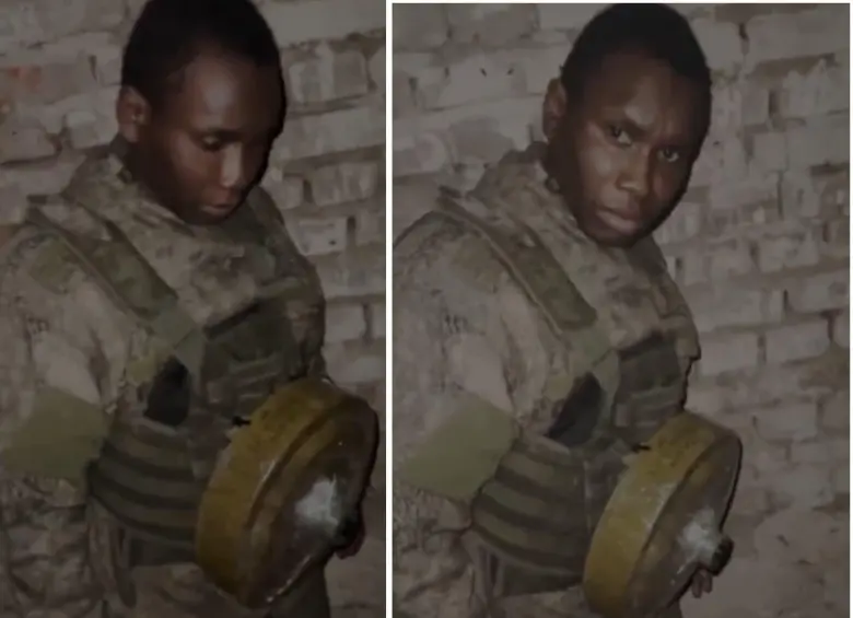 La imagen de Francis Ndung’u Ndarua con una minta antipersonal atada en el pecho. FOTOS: Capturas de video 