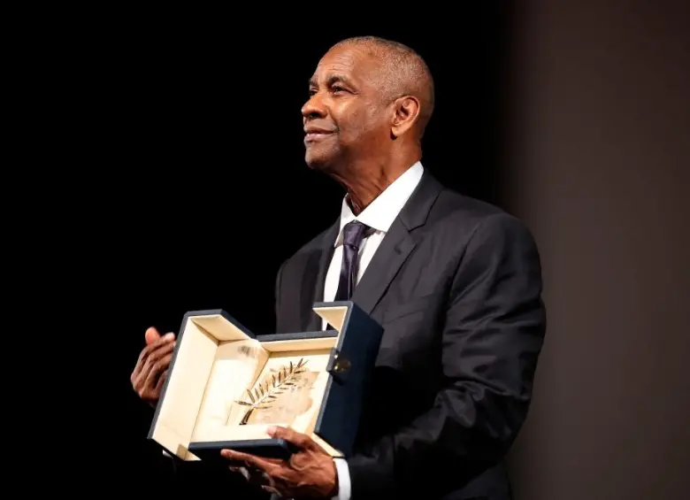 Denzel Washington fue homenajeado con una Palma de Oro sorpresa en el Festival de Cannes 2025. FOTO AFP