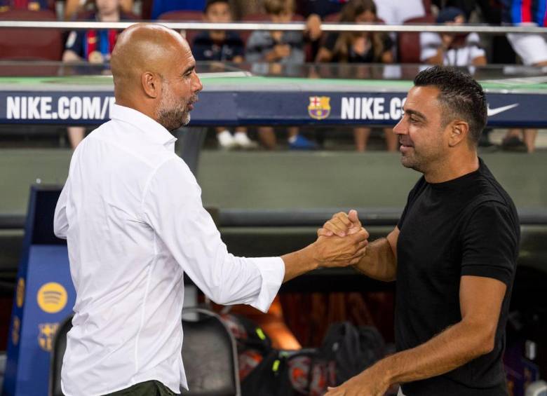 Pep Guardiola y Xavi Henández, técnicos y amigos. FOTO: TOMADA DE TWITTER @FCBarcelona_es