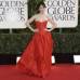 AP - Zooey Deschanel, que apostó por un Oscar de la Renta con escote corazón, collar, pulsera y pendientes de perlas y el pelo recogido en una coleta, buscaba un look socialité de los años 60, según comentó a los medios.