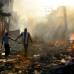 Reuters - Esta foto llamada Life Amid the Ruins (vida entre las ruinas) de Carol Guzy del Washington Post muestra a una pareja que camina entre los escombros de Puerto Pr&#237;ncipe, Hait&#237;.