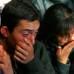 AP - La emoci&#243;n de amigos y familiares que aguardan en los alrededores de la mina por la salida de sus familiares.