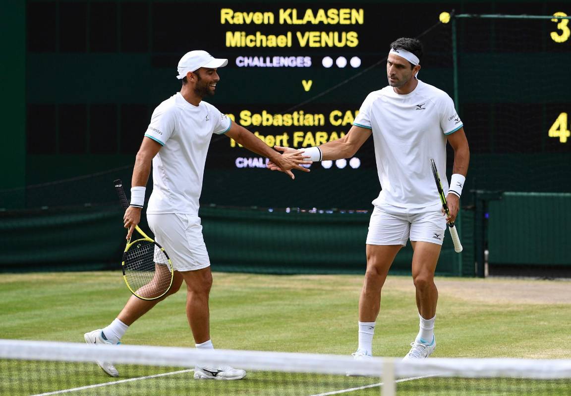 Juan Sebastian Cabal y Robert Farah. FOTO: AFP