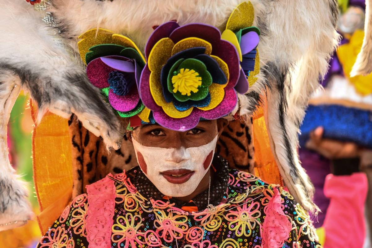 Rostros durante el Carnaval de Barranquilla. Foto: JOAQUIN SARMIENTO / AFP