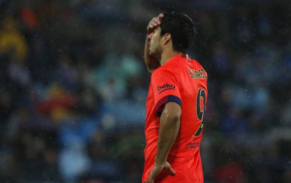 El poder ofensivo del Barcelona no pudo con el cerrojo defensivo del Getafe. FOTO REUTERS.