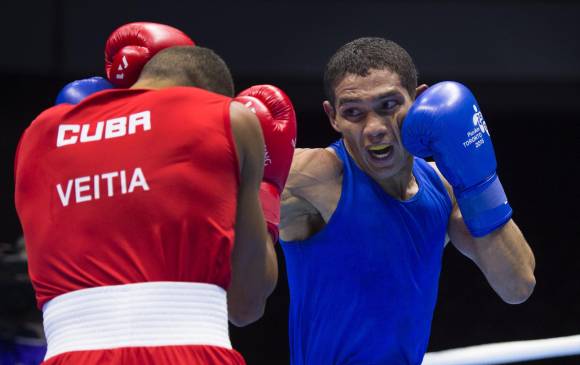 El boxeador antioqueño Ceiber Ávila trabaja en el Urabá antioqueño con la ilusión de ganar un cupo olímpico. FOTO AFP
