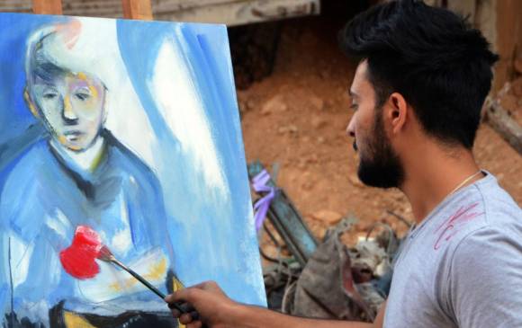 Pintar entre las ruinas de la guerra en Siria