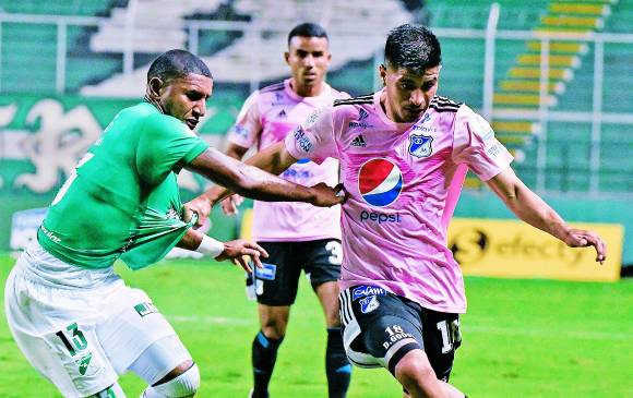 En la imagen, Juan C. Angulo del Cali, frente al paraguayo Diego Godoy de Millonarios. FOTO Dimayor 