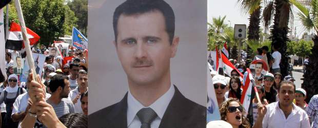 El presidente de Siria decretó amnistía general para calmar protestas | Reuters | Miles de personas marcharon para darle su apoyo al presidente de Siria.