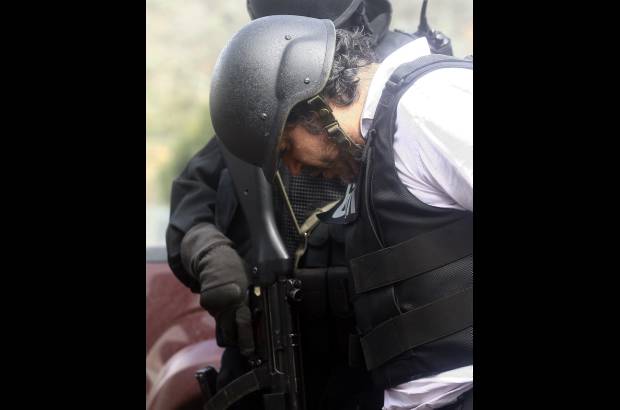 Reuters - Alias RQ fue sorprendido en una panader&#237;a del norte de Quito, Ecuador, cuando estaba reunido con un grupo de personas.