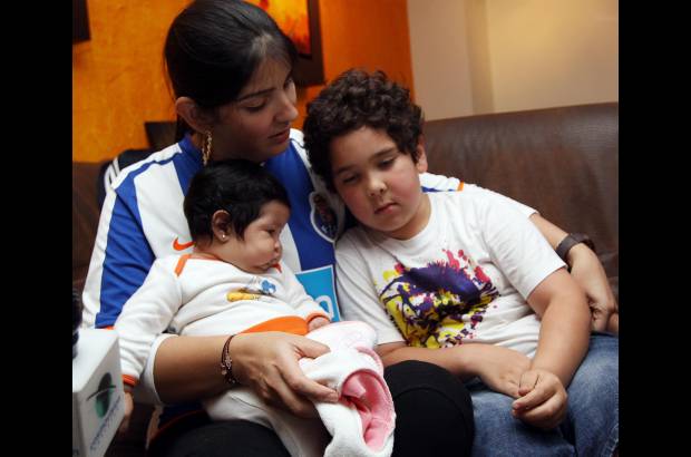 Julio César Herrera - Andreína con sus hijos Daniel Alejandro y Dana, los amores del Fredy, uno de los motores del Porto.