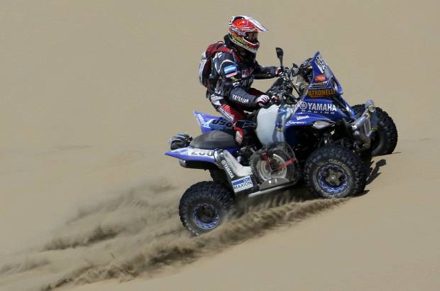 REUTERS - En la categor&#237;a de cuatrimotos, el argentino Marcos Patronelli, subcampe&#243;n en 2012, lleg&#243; primero sobre su Yamaha.