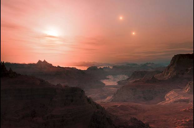 Reuters - Esta impresi&#243;n art&#237;stica muestra una puesta de sol vista desde el CC s&#250;per-Tierra Gliese 667. Los astr&#243;nomos han calculado que hay decenas de miles de millones de tales mundos rocosos.