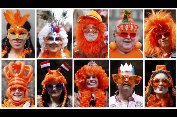 Reuters - El naranja fue el color de los asistentes que querían saludar al nuevo rey de Holanda.