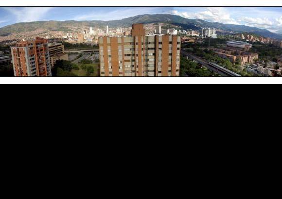 Henry Agudelo - Medellín vista desde las Torres de Suramericana, en el sector del Estadio. Al fondo el centro de la ciudad. A la derecha, el centro de espectáculos La Macarena, antigua Plaza de Toros.