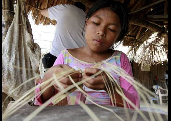 Foto Donaldo Zuluaga - Los ni&#241;os aprenden a trenzar desde los 5 a&#241;os de edad.