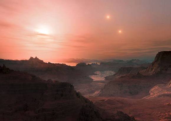 Reuters - Esta impresi&#243;n art&#237;stica muestra una puesta de sol vista desde el CC s&#250;per-Tierra Gliese 667. Los astr&#243;nomos han calculado que hay decenas de miles de millones de tales mundos rocosos.