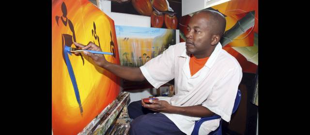 Gilmar busca otro salto: pintar a toda Colombia | En la tranquilidad del cuarto que adaptó en su apartamento, Gilmar se dedica a la pintura. Es una de las actividades que más le gusta hacer. FOTO MANUEL SALDARRIAGA