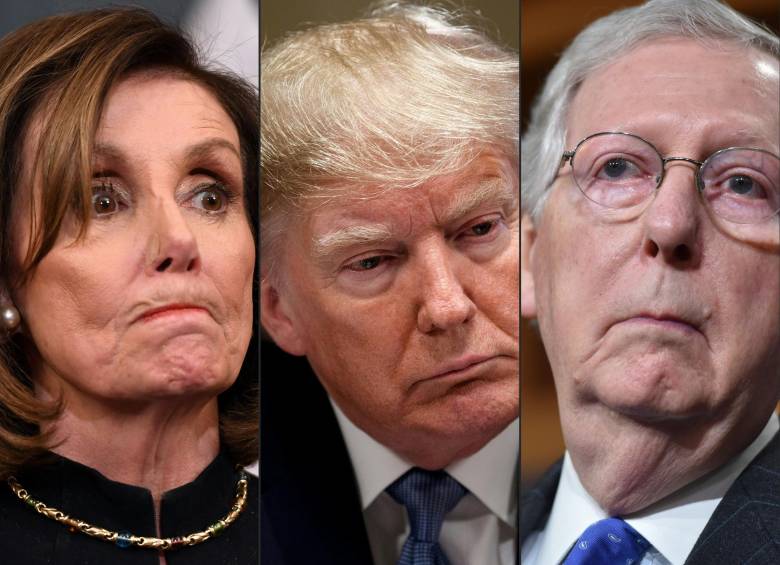 La presidenta de la Cámara de EE.UU., Nancy Pelosi; el presidente Donald Trump y el lider de la mayoría en el Senado, Mitch McConnel. FOTO AFP.
