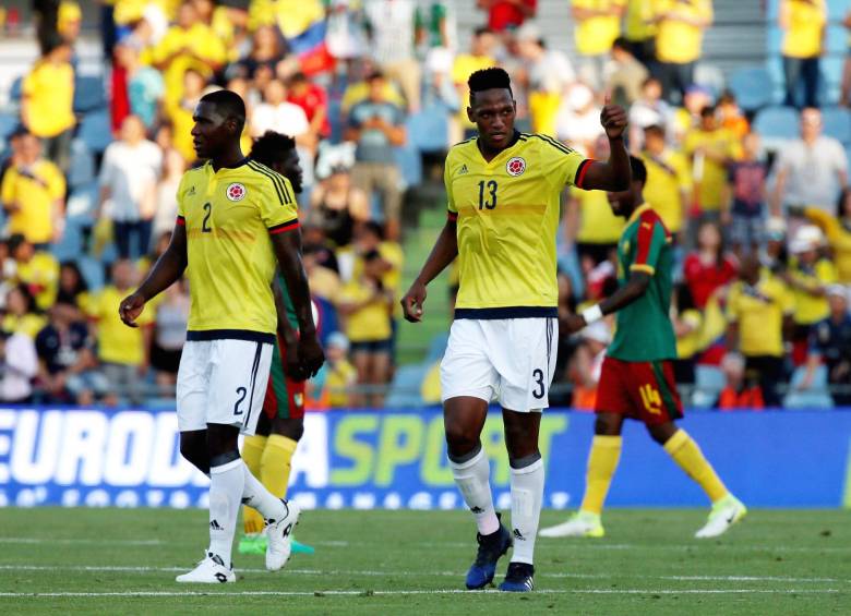 Yerry Mina (derecha) está tomando ritmo tras ser baja dos meses por lesión. FOTO REUTERS