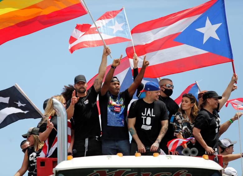 Bad Bunny, Residente, Ricky Martin y otros cantantes que se unieron a las protestas de Puerto Rico. FOTO: REUTERS