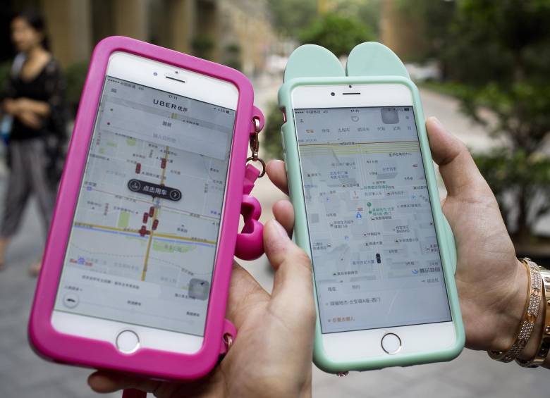 Uber fusionará su negocio en China con su rival local Didi Chuxing. FOTO AP