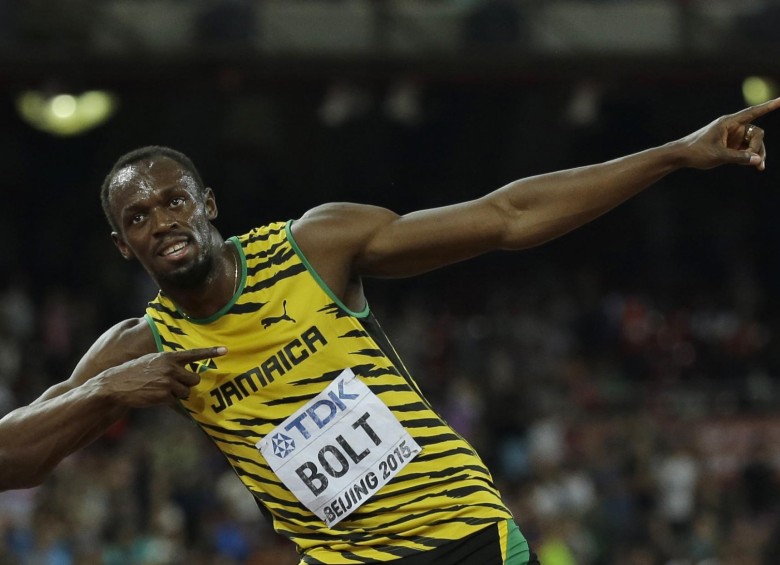 El jamaiquino celebró su primer lugar en los 100 metros del Mundial de atletismo en China. FOTO ap